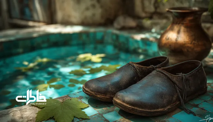 کفش سنتی ایرانی کنار تشت مسی پر از آب؛ نماد فروتنی و سادگی در فرهنگ ایرانی. کفش در ادبیات