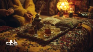 کرسی ایرانی با لحاف گلدار و سماور بخارکننده در شب‌های زمستان؛ نماد دورهمی خانوادگی و گرمای جمعی در خانه‌های ایرانی